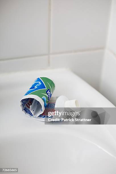 rolled up tube of toothpaste - toothpaste stock pictures, royalty-free photos & images