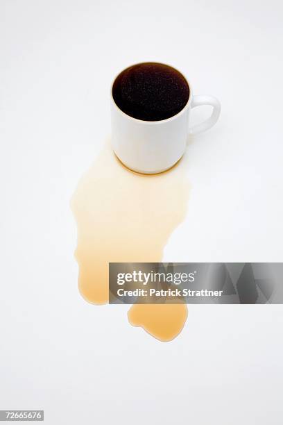 cup of coffee overflowing - coffee spill stock pictures, royalty-free photos & images