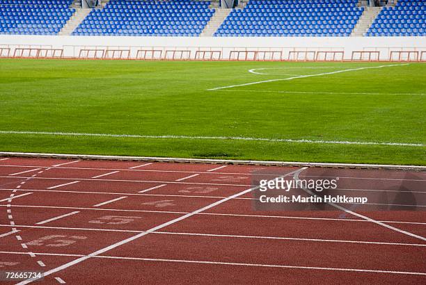 empty sports stadium - track and field stadium stockfoto's en -beelden