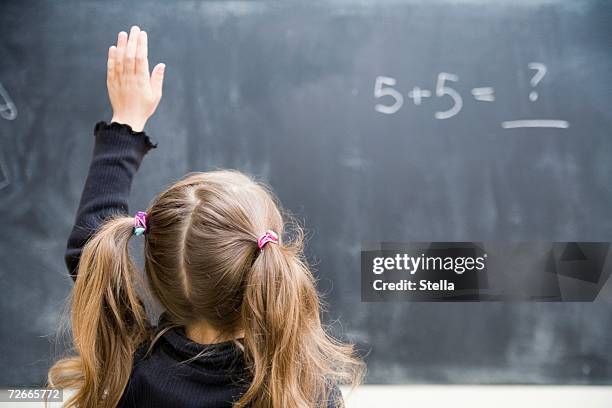 girl in classroom with raised hand - hair back bildbanksfoton och bilder