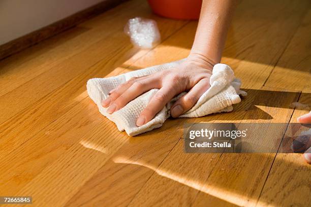 hand clean wooden floor with rag - wooden floor stock-fotos und bilder