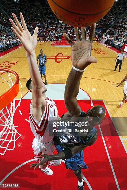 Kevin Garnett of the Minnesota Timberwolves shoots the ball over Yao Ming of the Houston Rockets on November 28, 2006 at the Toyota Center in...