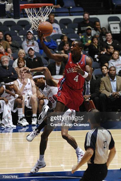 Jason Smith of the Arkansas RimRockers glides to the basket past Jerry Dupree of the Anaheim Arsenal during their NBDL game on November 28, 2006 at...