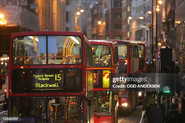 United Kingdom: London buses are pictured in traffic at Ludgate Circus in central London, 23 November 2006. AFP PHOTO/ODD ANDERSEN