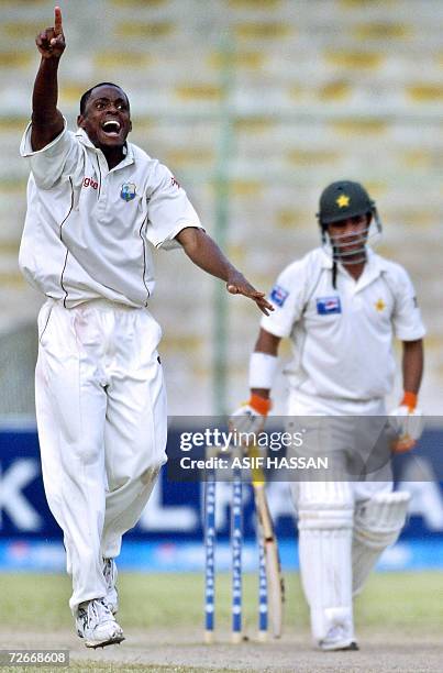 West Indies bowler Daren Powell makes a successful appeal for a Leg Before Wicket decision against Pakistani cricketer Imran Farhat during the third...