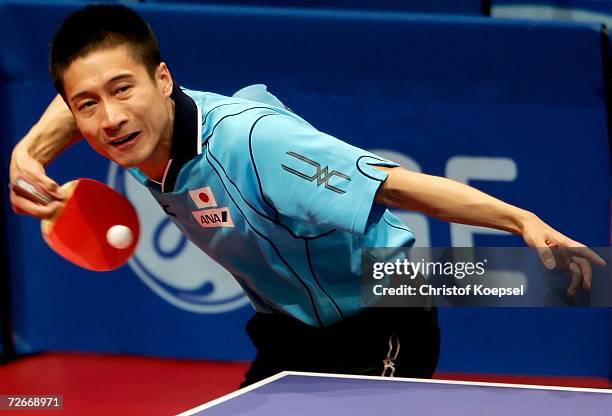 Kaii Yoshida of Japan returns a shot during the Men's Team Round One at the 15th Asian Games Doha 2006 at Al-Arabi Indoor Hall November 29, 2006 in...