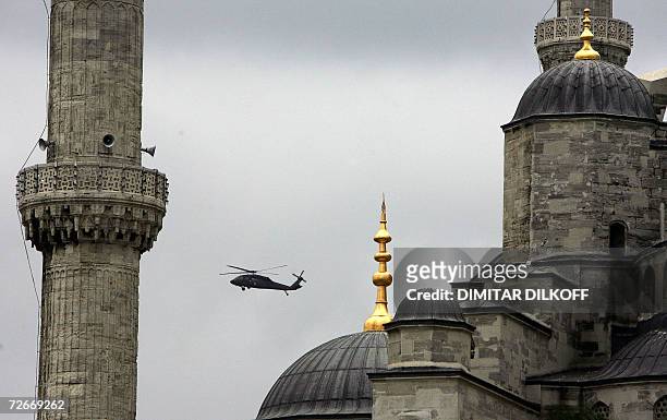 Turkish army helicopter flies over the famous Blue Mosque in Istanbul 29 November 2006. Pope Benedict XVI began today the religious leg of his...