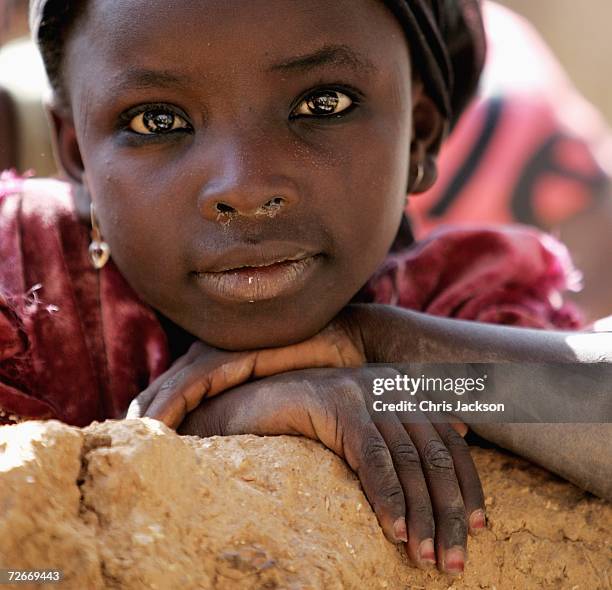 Local girl poses for the camera in Dawakin Kudu village on November 29, 2006 near Freetown, Sierra Leone. The village is famous for the indigo...