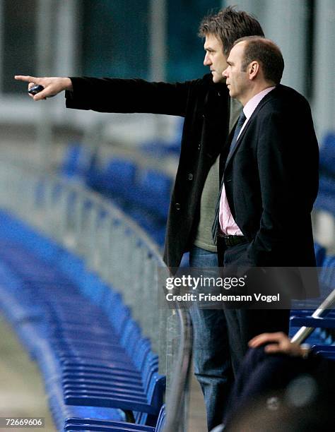 Manager Dietmar Beiersdorfer and President Bernd Hoffmann watch the players during the training session of Hamburger SV on November 29, 2006 in...