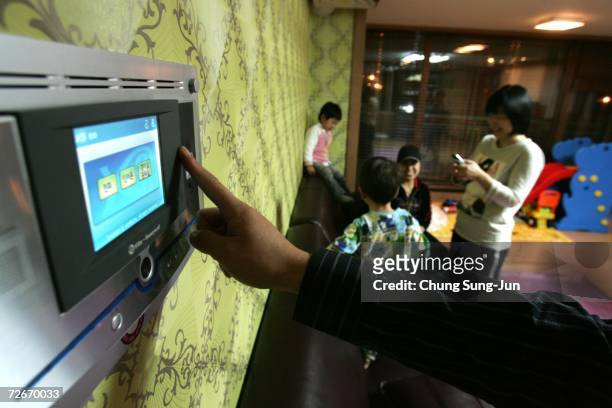Ji Young-Hoon , controls an electronic appliance in his house using a control panel on November 29, 2006 in Incheon, South Korea. The Home Network...