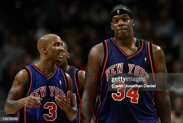 Stephon Marbury of the New York Knicks talks with Eddy Curry as they walk up court against the Chicago Bulls November 28, 2006 at the United Center...