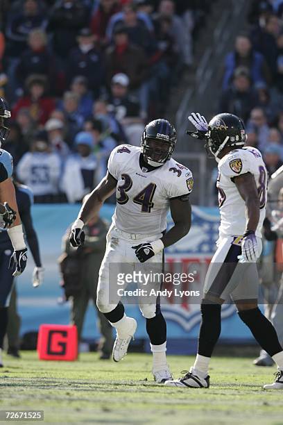 Ovie Mughelli of the Baltimore Ravens celebrates after scoring a touchdown against the Tennessee Titans on November 12, 2006 at LP Field in...