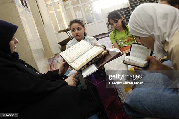 Zainab Al-Iman teaches Quran to young girls inside Zahra Mosque on July 13, 2006 in Damascus, Syria. Zainab holds a degree in Shariah from Damascus....