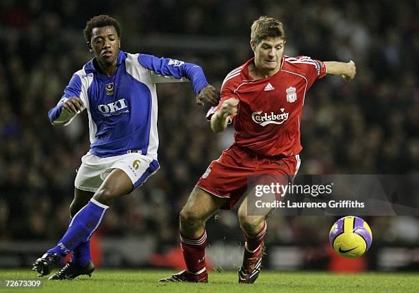 Steven Gerrard of Liverpool battles with Manuel Fernandes of Portsmouth during the Barclays Premiership match between Liverpool and Portsmouth at...