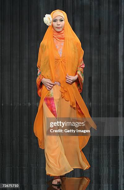 Model wears Kapas Couture at the Islamic Fashion Festival on the third day of Malaysian-International Fashion Week at the Kuala Lumpur Convention...