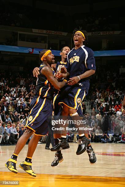 Stephen Jackson, Danny Granger and Marquis Daniels of the Indiana Pacers celebrate their victory against the Golden State Warriors on November 29,...