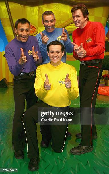 The Wiggles children's entertainers Jeff Fatt, Anthony Field, Sam Moran and Murray Cook pose for a photo on stage after The Wiggles held a press...