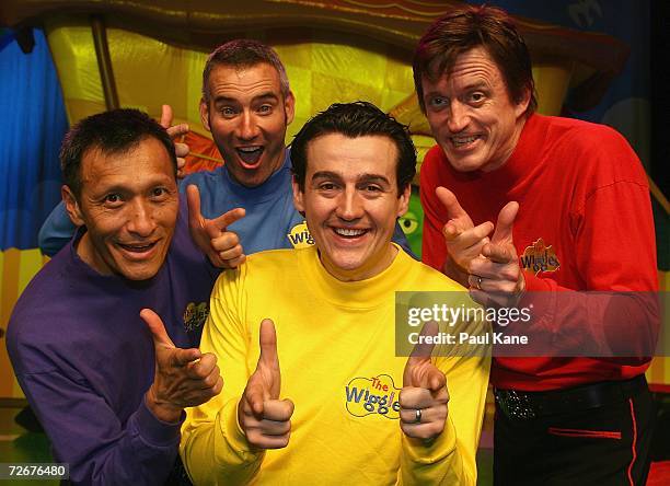 The Wiggles children's entertainers Jeff Fatt, Anthony Field, Sam Moran and Murray Cook pose for a photo on stage after The Wiggles held a press...