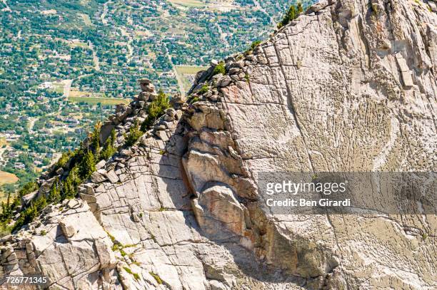 a group of friends work there way to the top of the climbing route on lone peak located in utahs wasatch mountains - utah lake stock pictures, royalty-free photos & images
