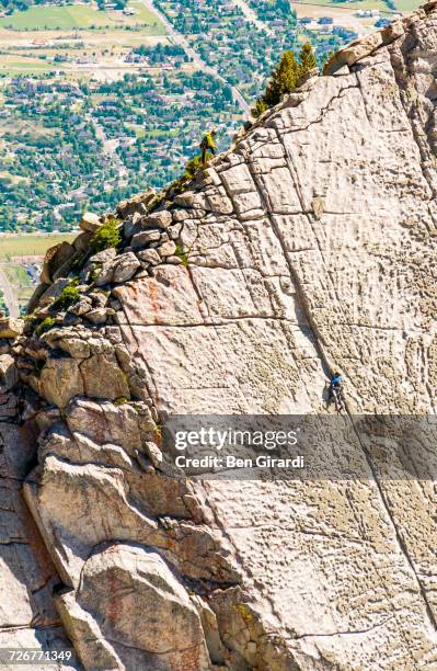 a group of friends work there way to the top of the climbing route on lone peak located in utahs wasatch mountains - utah lake stock pictures, royalty-free photos & images