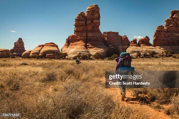 backpacker in canyonlands national park, utah, usa - canyonlands national park stock pictures, royalty-free photos & images