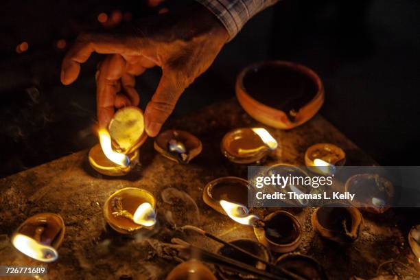 oil lamp offering at kamakhya temple in assam - diya oil lamp fotografías e imágenes de stock