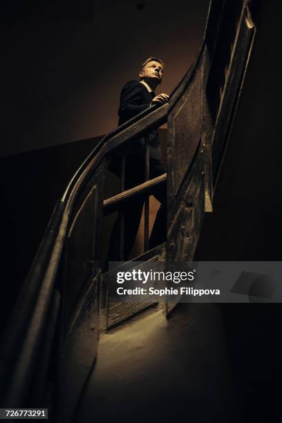 caucasian businessman climbing staircase - candid black and white corporate stock pictures, royalty-free photos & images