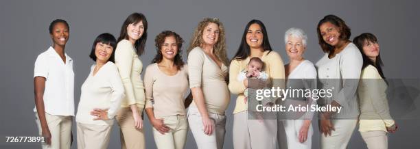 portrait of diverse group of smiling women - babies in a row stock pictures, royalty-free photos & images