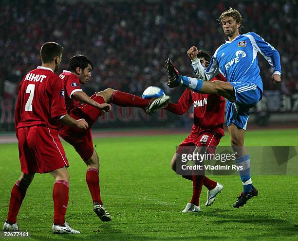 Andrei Margaritescu of Dinamo and Stefan Kiessling of Leverkusen battle for the ball during the UEFA Cup Group B match between Dinamo Bucharest and...