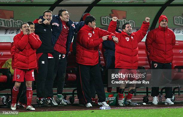 The bench of Dinamo celebrates shortly before the final whistle winning 2:1 at the UEFA Cup Group B match between Dinamo Bucharest and Bayer...