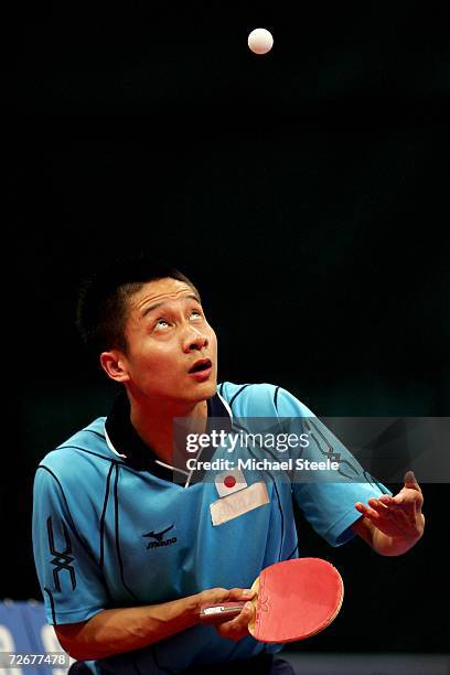 Kaii Yoshida of Japan serves to Ma Long of China during the Men's Table Tennis Team Stage One at the 15th Asian Games Doha 2006 at Al-Arabi Indoor...