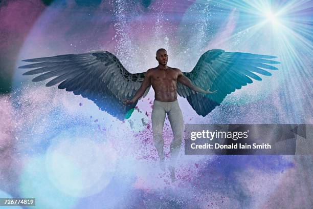 man with angel wings flying in purple sky - man angel wings stock pictures, royalty-free photos & images