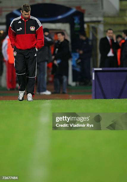 Coach Michael Skibbe of Leverkusen looks down crossing the field to attend at the press conference after losing 2:1 the UEFA Cup Group B match...