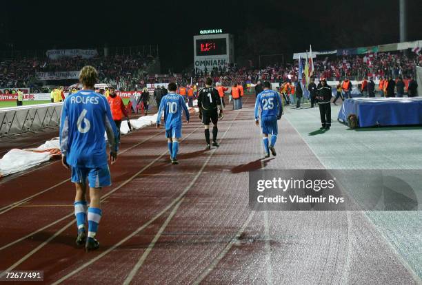 Simon Rolfes of Leverkusen and his team mates leave the stadium after losing 2:1 the UEFA Cup Group B match between Dinamo Bucharest and Bayer...