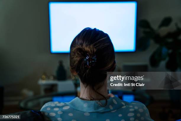 woman watching television in the dark - late night television bildbanksfoton och bilder