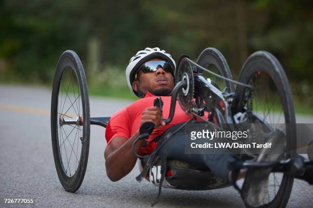 African American man riding handcycle