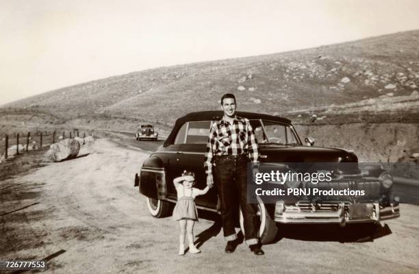 portrait of caucasian father and daughter posing near vintage car - 1950's cars ストックフォトと画像