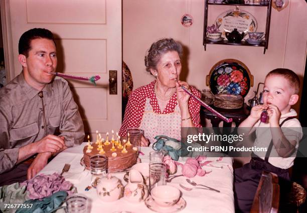 multi-generation family celebrating birthday - happy birthday vintage fotografías e imágenes de stock