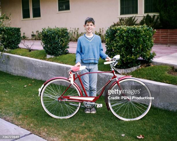 portrait of smiling caucasian boy posing with bicycle - vintage bicycle stock pictures, royalty-free photos & images