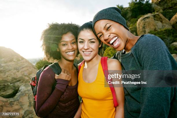 portrait of smiling women hiking - african american hiking stock pictures, royalty-free photos & images