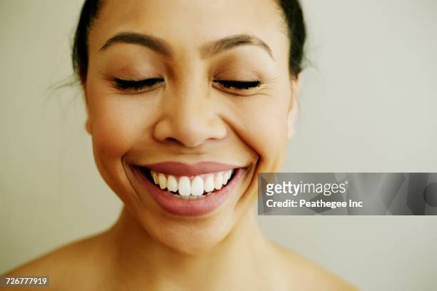 portrait of smiling asian woman with eyes closed - beautiful filipino women stock pictures, royalty-free photos & images