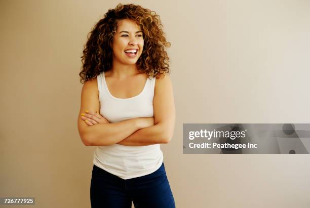 portrait of laughing mixed race woman - arab people laugh stock-fotos und bilder