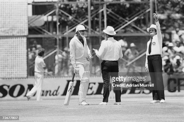 Australian cricketer Dennis Lillee talks to officials about his illegal aluminium bat during the first Test against England at Perth, December 1979....
