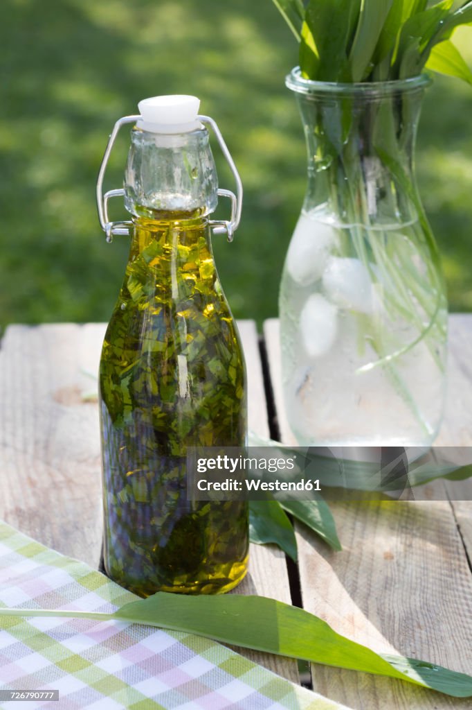 Swing top bottle of chopped ramson in olive oil