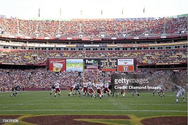 Quarterback Jason Campbell, of the Washington Redskins, hands the ball to runningback Ladell Betts in the fourth quarter of a game on November 26,...