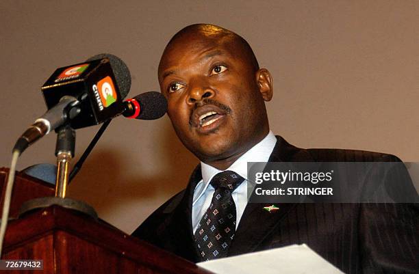 Arusha, TANZANIA, UNITED REPUBLIC OF: Burundian President Pierre Nkurunziza addresses the 8th summit of the East African community after his country...