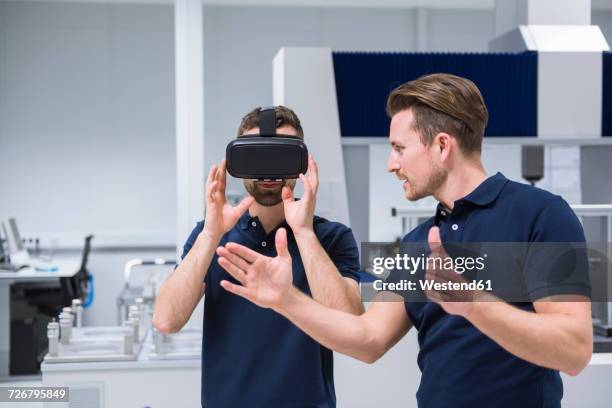 two men in testing instrument room with vr glasses - virtual reality glasses stockfoto's en -beelden