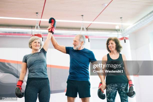 group of happy seniors working out in gym, boxing - boxing winner stock pictures, royalty-free photos & images