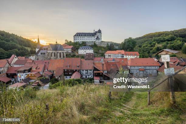 germany, saxony-anhalt, stolberg, townscape and stolberg castle in the evening - saxony anhalt stock-fotos und bilder