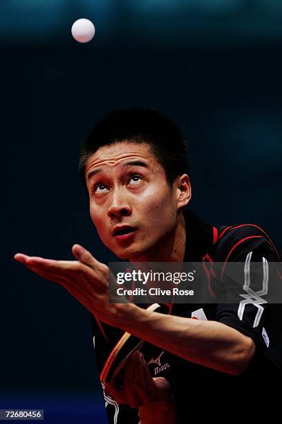 Kaii Yoshida of Japan serves to Li Ching of Hong Kong, China during the Men's Table Tennis Team Quarter Finals at the 15th Asian Games Doha 2006 at...